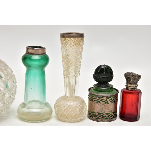 152 - A GROUP OF 19TH AND EARLY 20TH CENTURY SILVER AND WHITE METAL MOUNTED SCENT BOTTLES AND TOILET JARS ... 