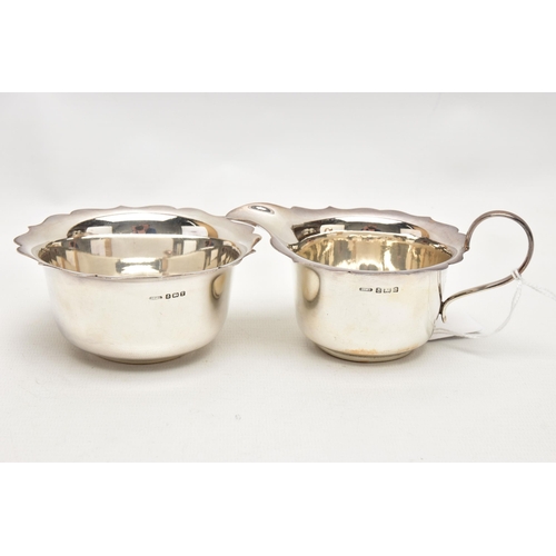 169 - A GEORGE VI SILVER CREAM JUG AND SUGAR BOWL WITH WAVY RIMS, maker Arnold E Williams, Birmingham 1943... 