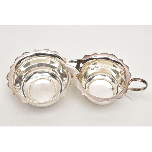 169 - A GEORGE VI SILVER CREAM JUG AND SUGAR BOWL WITH WAVY RIMS, maker Arnold E Williams, Birmingham 1943... 