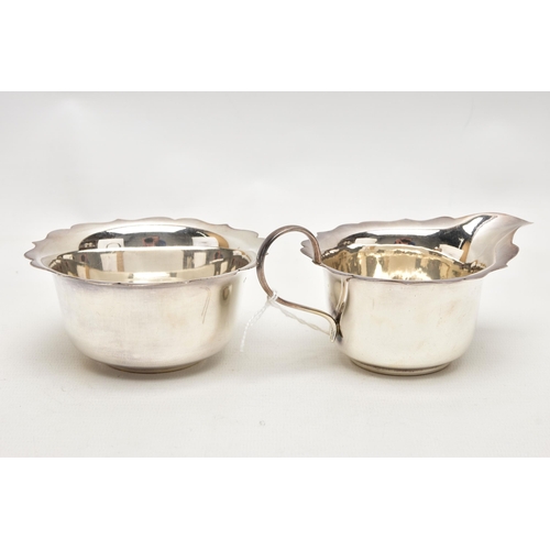 169 - A GEORGE VI SILVER CREAM JUG AND SUGAR BOWL WITH WAVY RIMS, maker Arnold E Williams, Birmingham 1943... 