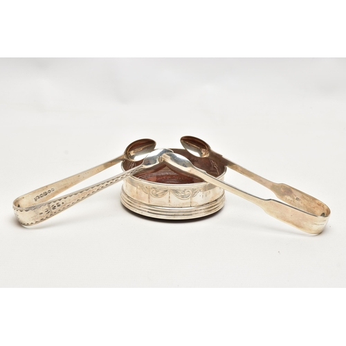 181 - TWO PAIRS OF SILVER SUGAR TONGS AND A COASTER, the first a pair of mid Victorian, bright cut sugar t... 