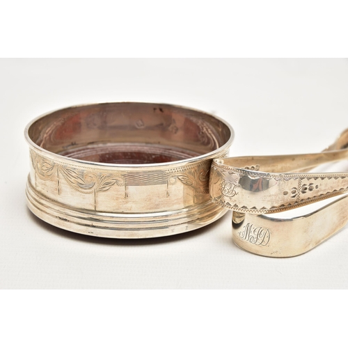 181 - TWO PAIRS OF SILVER SUGAR TONGS AND A COASTER, the first a pair of mid Victorian, bright cut sugar t... 