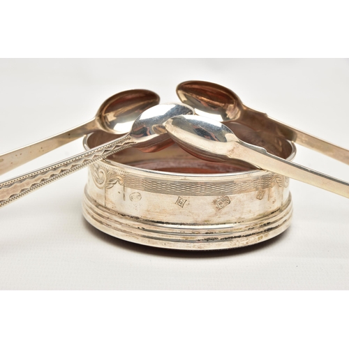 181 - TWO PAIRS OF SILVER SUGAR TONGS AND A COASTER, the first a pair of mid Victorian, bright cut sugar t... 