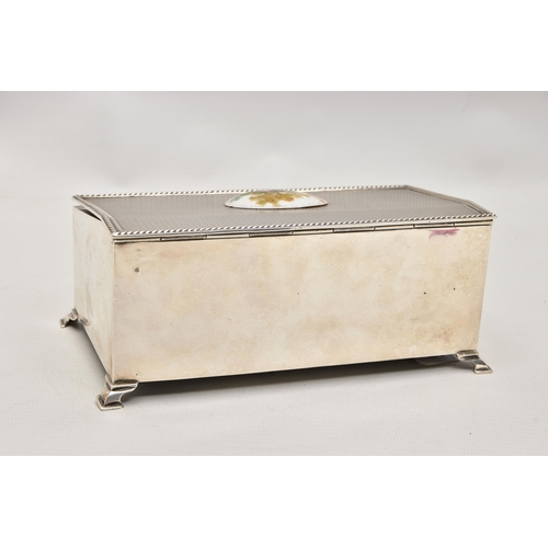 185 - AN EARLY 20TH CENTURY SILVER BOX, of a rectangular form, engine turned pattern, hinged cover fitted ... 