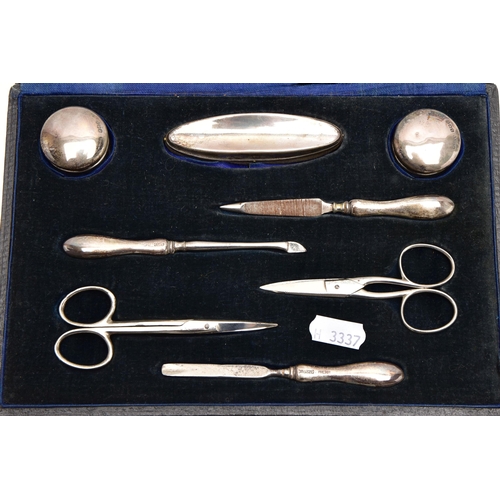 187 - AN EARLY 20TH CENTURY CASED SILVER MANICURE SET, case opens to reveal two small glass jars with silv... 