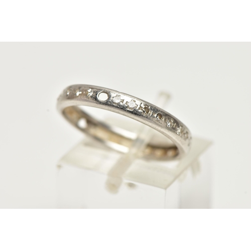 21 - A WHITE METAL DIAMOND SET FULL ETERNITY RING, polished band, set with single cut diamonds (three sto... 