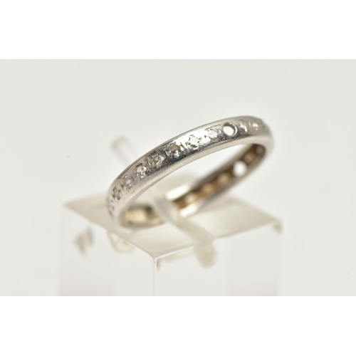 21 - A WHITE METAL DIAMOND SET FULL ETERNITY RING, polished band, set with single cut diamonds (three sto... 