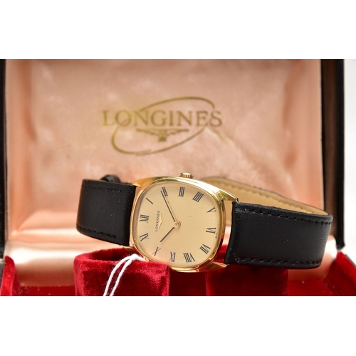 31 - A GENTS BOXED 'LONGINES' WRISTWATCH, manual wind, rounded square gold dial, signed 'Longines', Roman... 