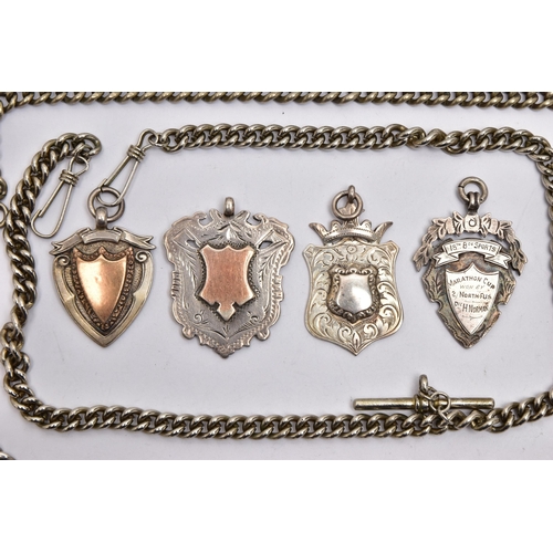 33 - THREE ALBERT CHAINS AND FOB MEDALS, a graduated silver albert chain fitted with a T-bar and lobster ... 