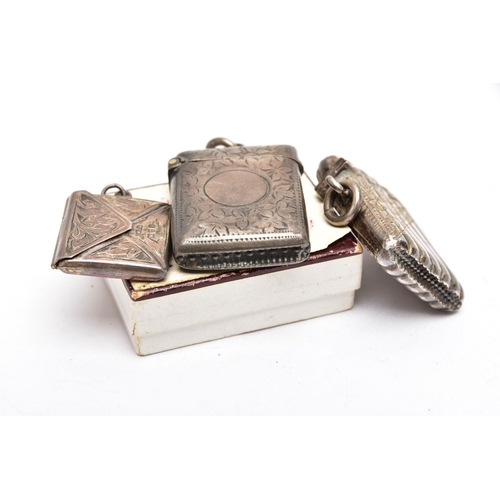 40 - TWO SILVER VESTA CASES AND A STAMP HOLDER, the first vesta of a rectangular form, decorated with a f... 