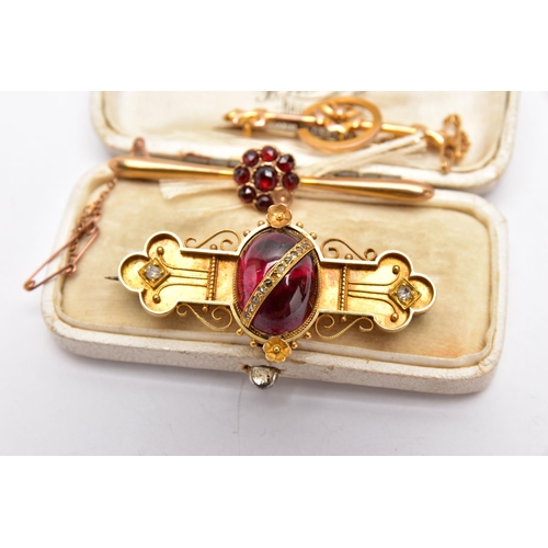 49 - THREE LATE VICTORIAN YELLOW METAL BROOCHES, the first set with a garnet cabochon to the centre, deta... 