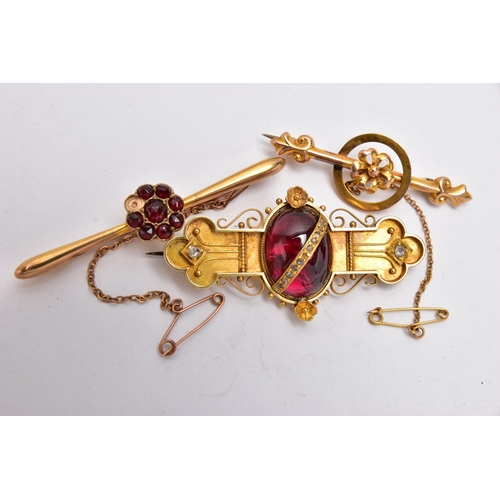 49 - THREE LATE VICTORIAN YELLOW METAL BROOCHES, the first set with a garnet cabochon to the centre, deta... 