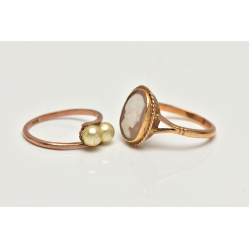 56 - TWO GEM SET RINGS, the first a yellow metal ring set with two imitation pearls in a bypass mount, st... 