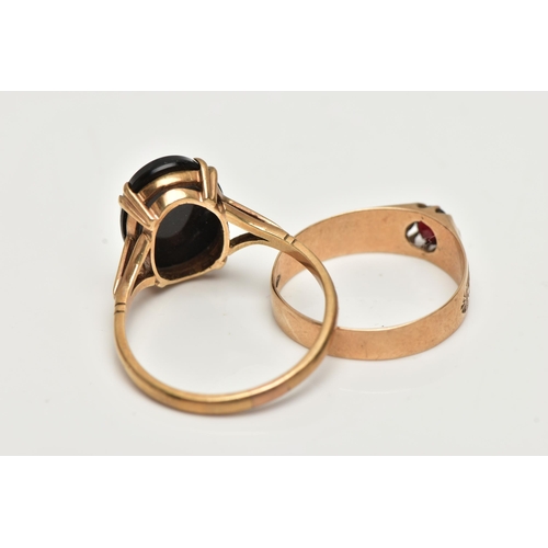 60 - TWO GEM SET RINGS, the first an oval onyx with carved detail, prong set in yellow metal, trifurcated... 