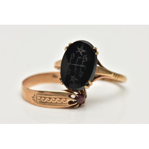 60 - TWO GEM SET RINGS, the first an oval onyx with carved detail, prong set in yellow metal, trifurcated... 