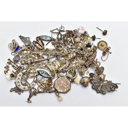 64 - AN ASSORTMENT OF WHITE METAL JEWELLERY, to include a Scottish brooch, chain necklaces, two charm bra... 