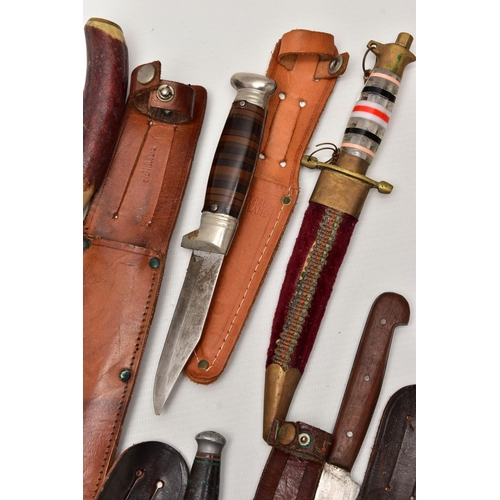 87 - FOUR SHEATH KNIVES WITH SHEATHS, the first by Rostrei Soligen, two by J Howell & Sons, Sheffield, an... 