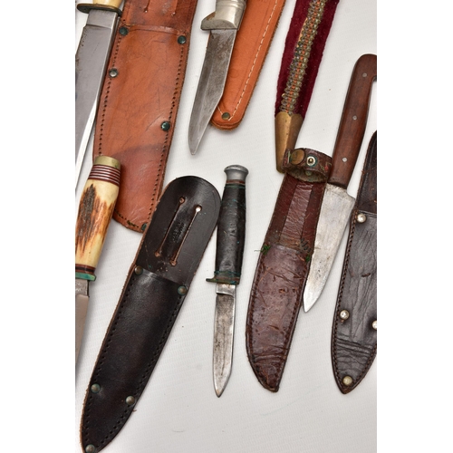 87 - FOUR SHEATH KNIVES WITH SHEATHS, the first by Rostrei Soligen, two by J Howell & Sons, Sheffield, an... 