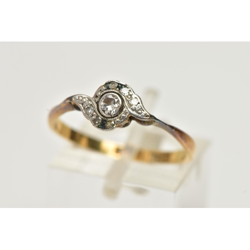 9 - A YELLOW METAL DIAMOND RING, designed with a central round brilliant cut diamond, collet set in a wh... 