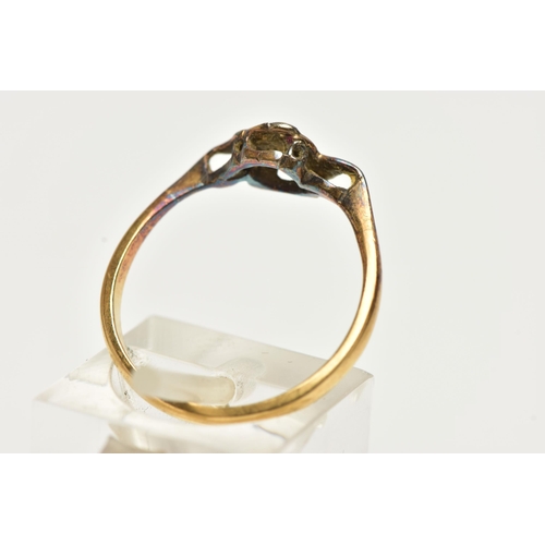 9 - A YELLOW METAL DIAMOND RING, designed with a central round brilliant cut diamond, collet set in a wh... 