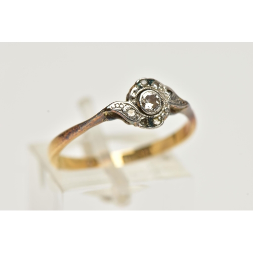 9 - A YELLOW METAL DIAMOND RING, designed with a central round brilliant cut diamond, collet set in a wh... 