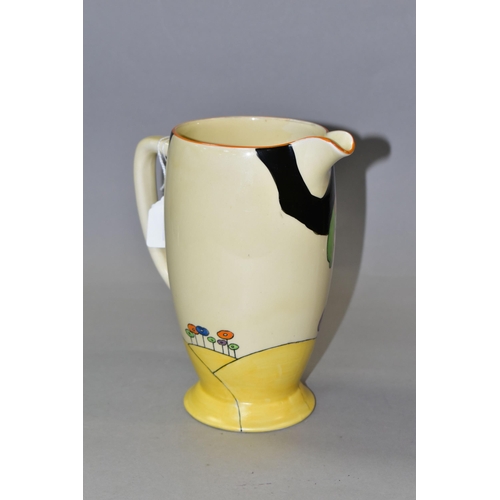 306 - A CLARICE CLIFF WOODLAND PATTERN WATER JUG, painted with an orange and green tree among blue, purple... 