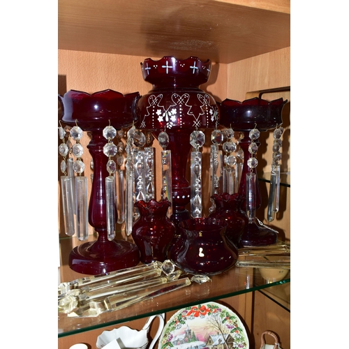 319 - THREE CRANBERRY GLASS LUSTRES, VASES AND SPARE LUSTRE DROPS, comprising a single cranberry glass lus... 