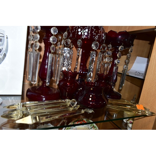 319 - THREE CRANBERRY GLASS LUSTRES, VASES AND SPARE LUSTRE DROPS, comprising a single cranberry glass lus... 