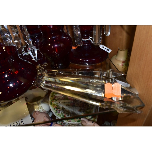 319 - THREE CRANBERRY GLASS LUSTRES, VASES AND SPARE LUSTRE DROPS, comprising a single cranberry glass lus... 