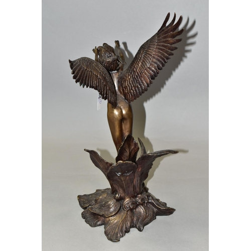 325 - A BRONZED FIGURE OF A FAIRY, standing, with her arms outstretched, inside a flower, indistinctly sig... 