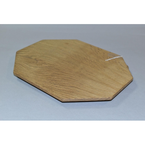 329 - A ROBERT 'MOUSEMAN' THOMPSON OAK BREAD BOARD, of octagonal form, modern and appears unused, approxim... 