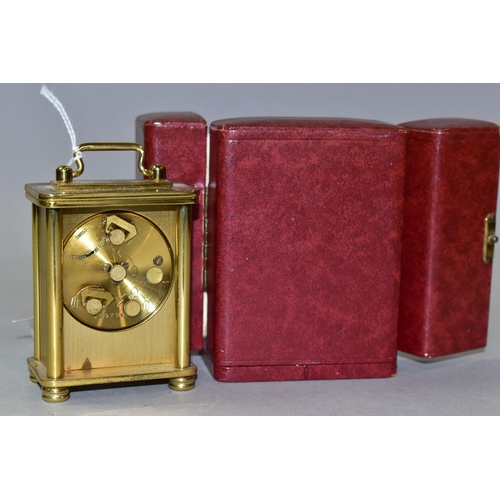 332 - A LOOPING MINIATURE 8 DAY CARRIAGE STYLE CLOCK, in burgundy leather covered case, height of clock (i... 