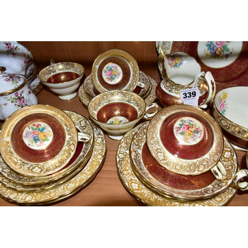 339 - A TWENTY ONE PIECE HAMMERSLEY TEA SET, in pattern 2396, with red and gilt borders around a central p... 