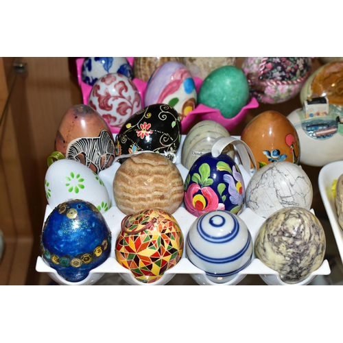 346 - A LARGE COLLECTION OF MARBLE AND CERAMIC EGGS, comprising three Fabergé style eggs, sixteen stone/ma... 