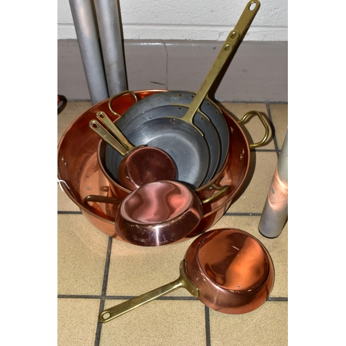 357 - A GROUP OF COPPER SAUCEPANS, to include two large copper pans, diameter 24cm and 34cm, together with... 