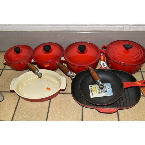 358 - A SET OF LE CREUSET 'CERISE' LIDDED SAUCEPANS AND COOKWARE, comprising three graduated covered sauce... 