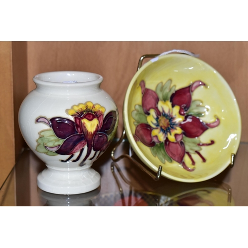 382 - TWO MOORCROFT POTTERY 'COLUMBINE' PATTERN PIECES, comprising a pedestal dish decorated with a purple... 