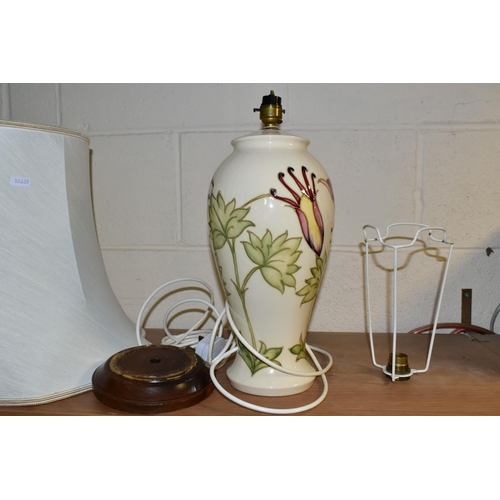 390 - A MOORCROFT POTTERY TABLE LAMP, in the Columbine pattern on a cream ground, with loose wooden base a... 