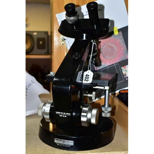 402 - WILD HEERBRUGG M12 BINOCULAR MICROSCOPE, complete with wooden box, Kohler lamp and box of accessorie... 