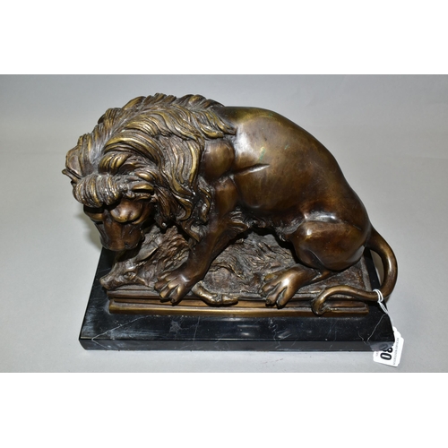 430 - A BRONZE STUDY OF A LION, seated with its kill - a wild boar, on a marble plinth, length 30cm x dept... 