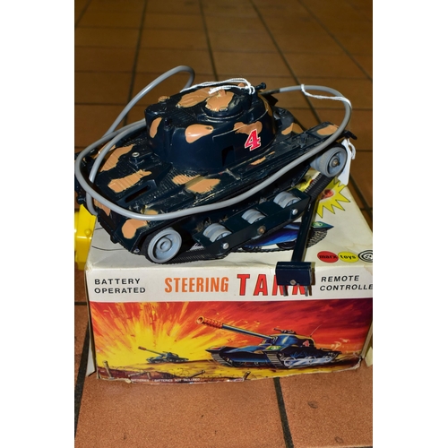 506 - A BOXED MARX TOYS STEERING TANK, remote controlled, battery operated, in play worn condition, with o... 