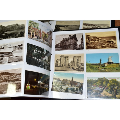 511 - POSTCARDS, two albums containing approximately 720 Edwardian and early-mid 20th century Postcards fe... 