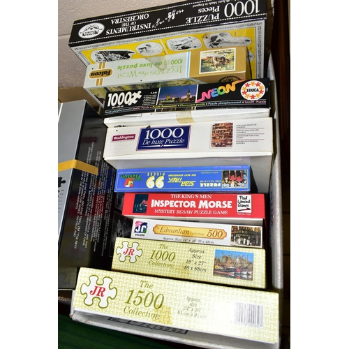 522 - A QUANTITY OF ASSORTED GAMES AND JIGSAW PUZZLES, contents not checked, games to include Monopoly, Tr... 