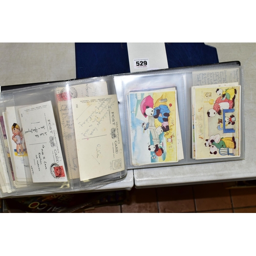 529 - POSTCARDS, one album containing 129 early 20th century Postcards on a Children's theme featuring exa... 