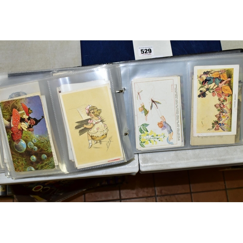 529 - POSTCARDS, one album containing 129 early 20th century Postcards on a Children's theme featuring exa... 