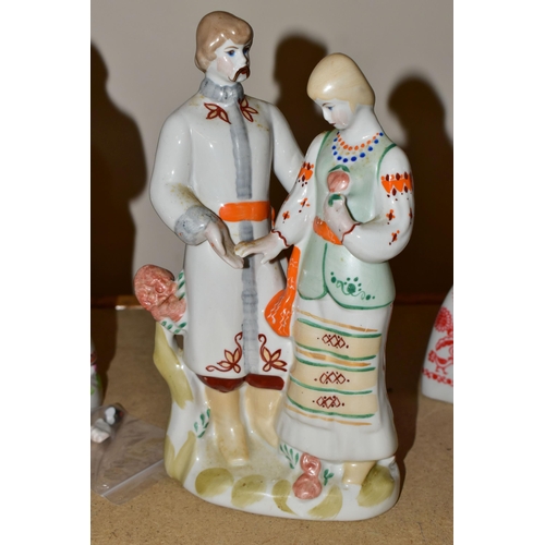 569 - EIGHT UKRANIAN AND SOVIET RUSSIAN FIGURES, mainly by Polone, comprising two women with needlework, a... 