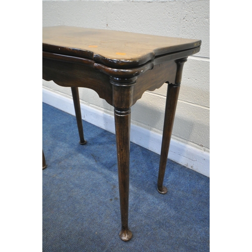 1200 - A GEORGIAN WALNUT SERPENTINE CARD TABLE, the fold over top enclosing a green baize playing surface a... 