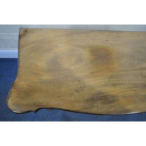 1200 - A GEORGIAN WALNUT SERPENTINE CARD TABLE, the fold over top enclosing a green baize playing surface a... 