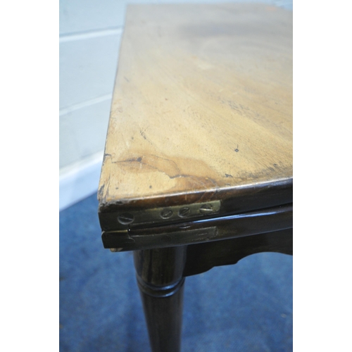 1200 - A GEORGIAN WALNUT SERPENTINE CARD TABLE, the fold over top enclosing a green baize playing surface a... 