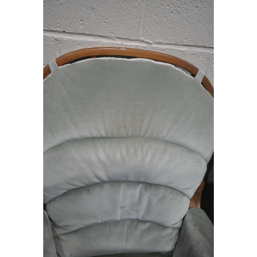 1328 - A MINT GREEN UPHOLSTERED WING BACK ARMCHAIR, and a glide motion rocking chair (condition - both in u... 